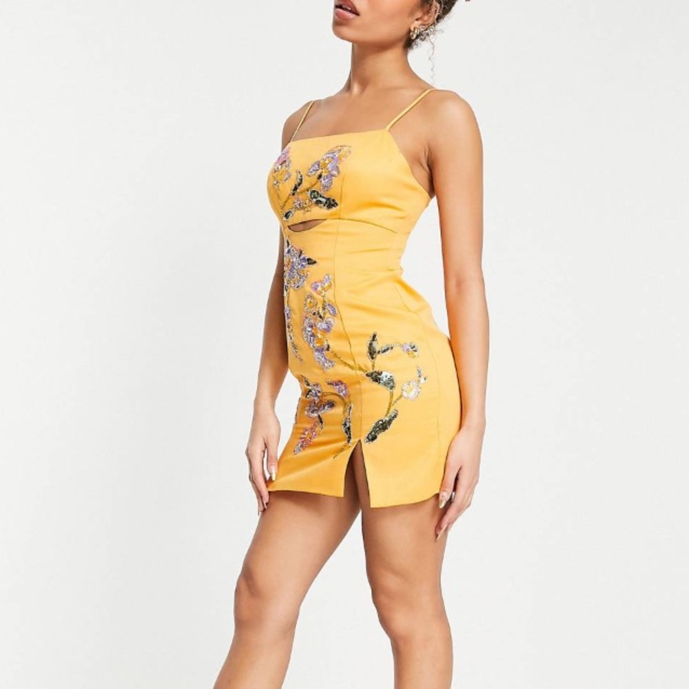 structured mini dress wth floral embellishment in orange
